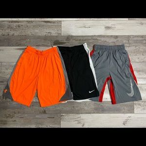 Nike 3 pair boys size Medium dry fit athletic shorts.